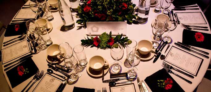 Festive table decorations for a dinner at the Mary Rose Museum
