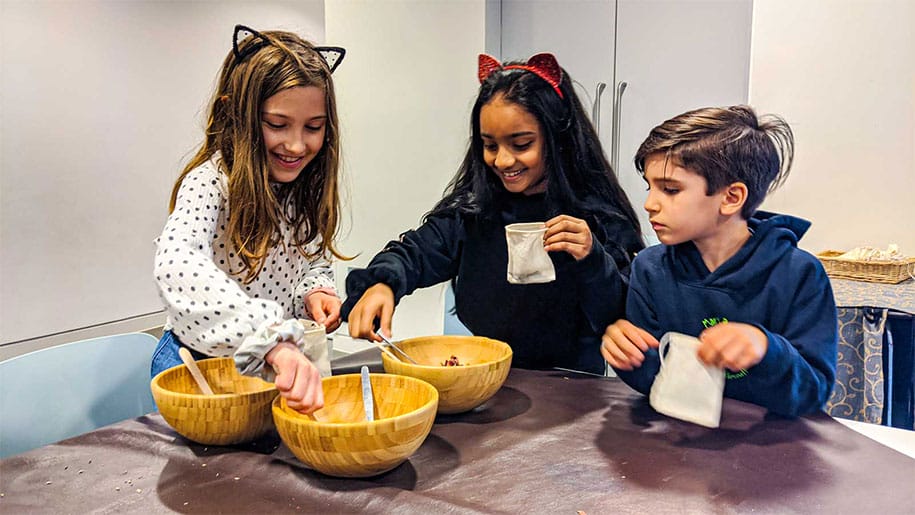Children making pomander bags at the Mary Rose Museum
